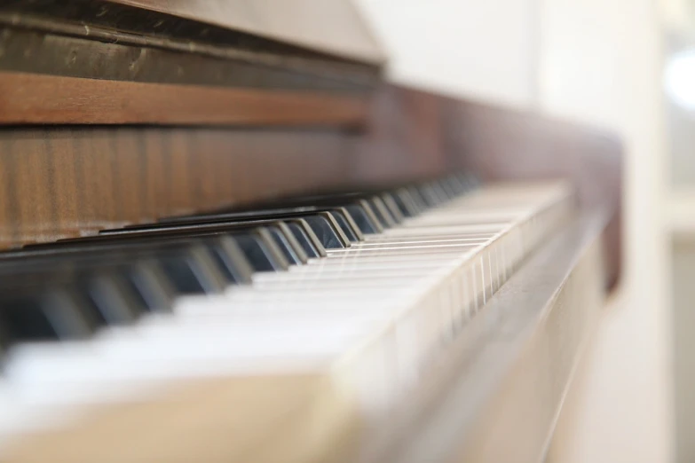 a close up of the keys of a piano, a picture, close up dslr photo, blurred photo, high res photo, discovered photo