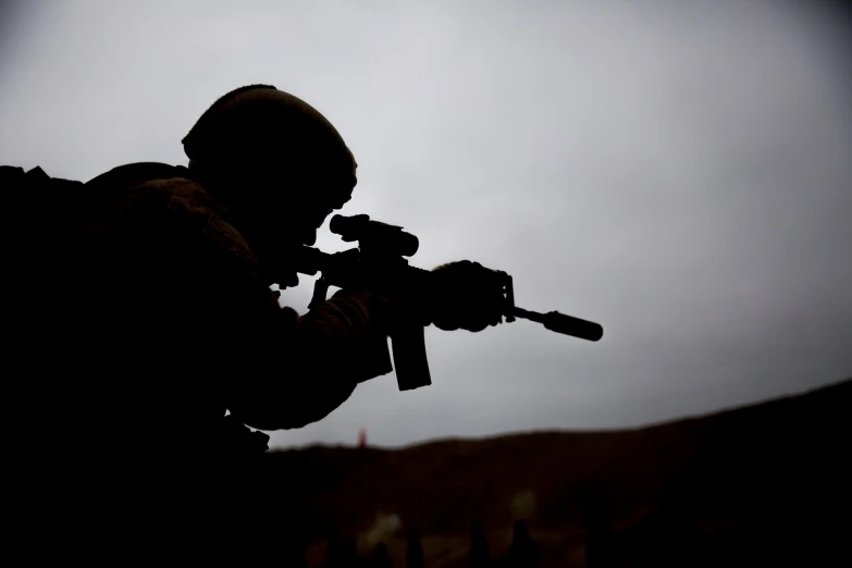 a silhouette of a soldier holding a rifle, flickr, french special ops, ireland, aiming, a wide shot