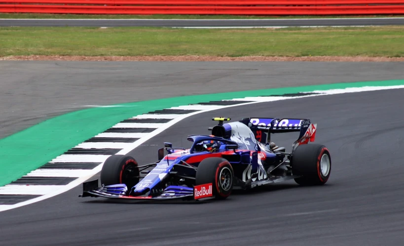 a man driving a race car on a track, a picture, shutterstock, max verstappen, london, sideview, full body wide shot