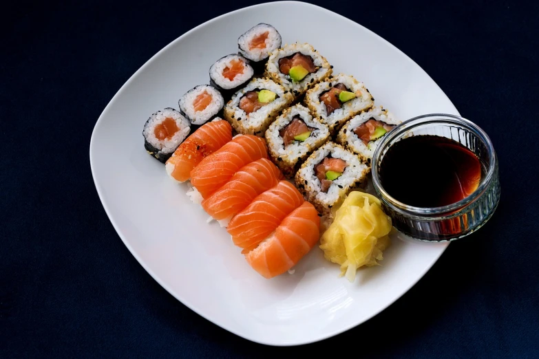 a white plate topped with different types of sushi, a picture, bauhaus, high quality photos, egypt, foodphoto, marketing photo