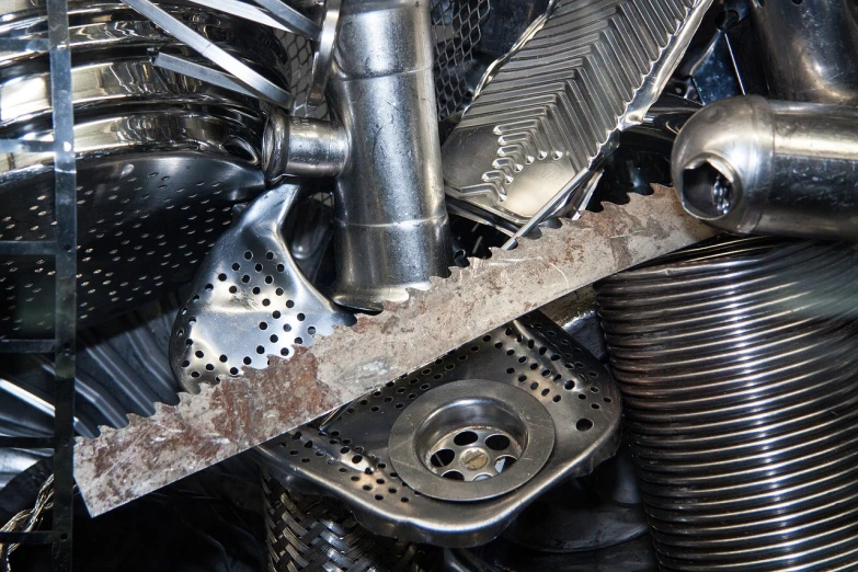 a close up of a bunch of metal items, assemblage, fotografia, high quality product image”, trash ; basement, saws