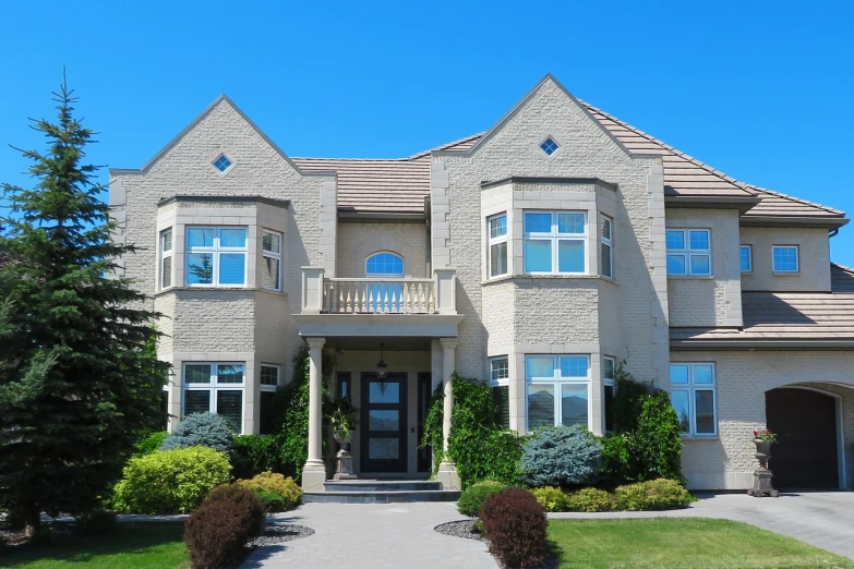 a house with a driveway in front of it, shutterstock, rich style, house windows, very very very rich, stucco walls