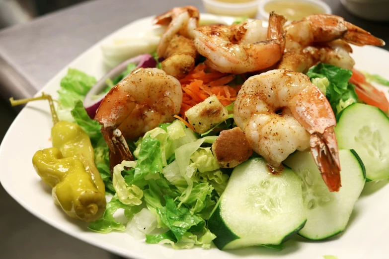 a close up of a plate of food on a table, shrimp, salad, daily specials, 1 6 x 1 6