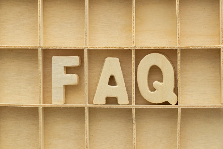 the word faq spelled in wooden letters on a shelf, a stock photo, by Jason Felix, shutterstock, folk art, subject center bottom of frame, transparent background, productphoto, wood panels