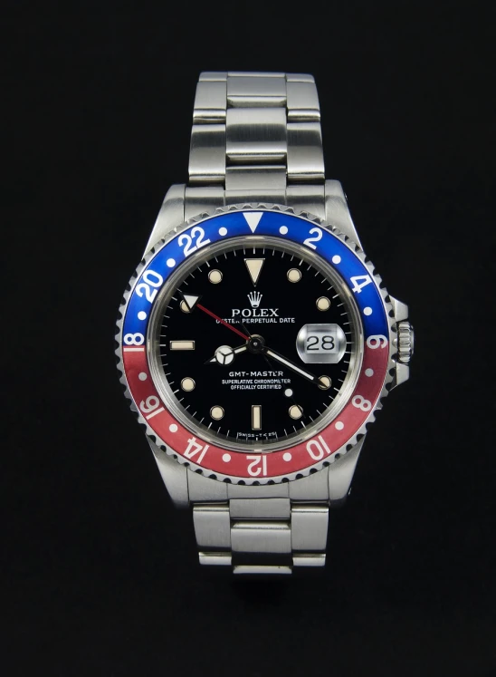 a close up of a watch on a black background, a portrait, reddit, pop art, colors red white blue and black, rolex, highly detailed product photo, 3/4 view realistic