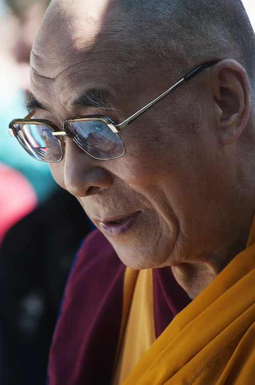 a close up of a person wearing glasses, a portrait, hurufiyya, lama, beijing, speech, bottom angle