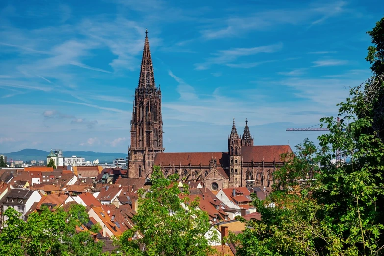 a view of a city from the top of a hill, a stock photo, by Juergen von Huendeberg, shutterstock, cathedral in the background, 🦩🪐🐞👩🏻🦳, germany. wide shot, stained”