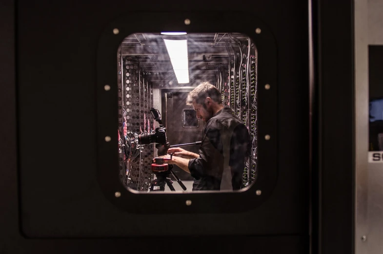 a man that is standing in front of a mirror, precisionism, arri alexa mini lf, hacking into the mainframe, camera obscura, maintenance photo