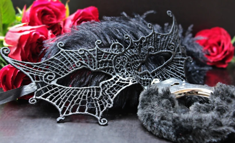 a pair of scissors sitting next to a bunch of red roses, a photo, pexels, gothic art, wearing a bejeweled mask, detailed intricate fur, spider webbed body, black jewellery