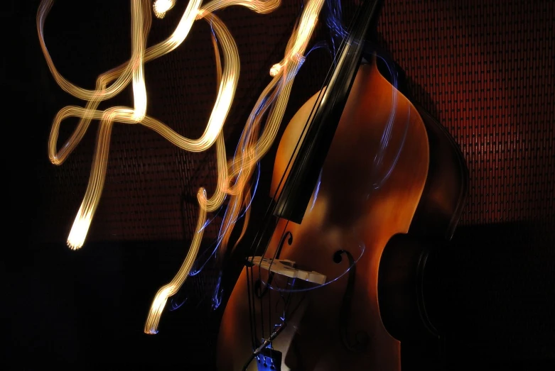 a close up of a person holding a violin, by Eugeniusz Zak, flickr, lyrical abstraction, wires and lights, double bass, organic form ”, 3 jazz musicians