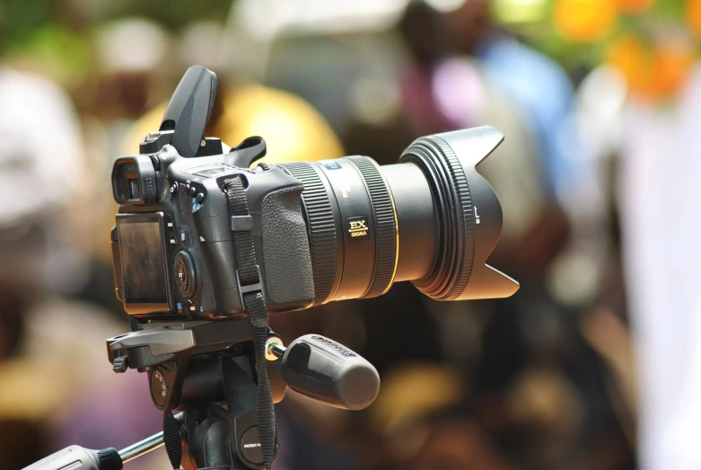 a close up of a camera on a tripod, by David Burton-Richardson, pixabay, photorealistic anamorphic lens, taken with a canon eos 5 d, petzval lens. featured on flickr, with nikon cameras