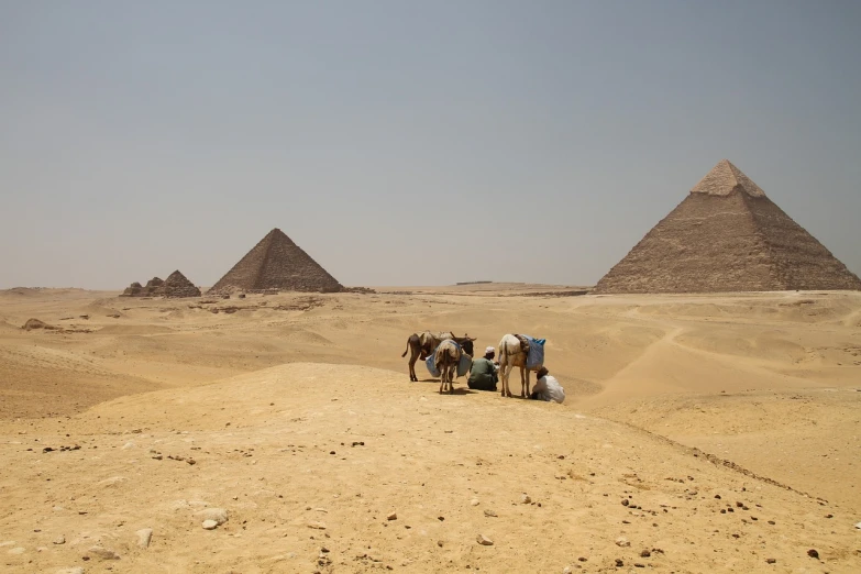 a group of people riding on the back of a camel, a picture, by Dietmar Damerau, great pyramid of giza, image from afar, thirst, sand piled in corners