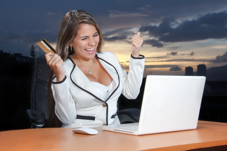 a woman holding a credit card and a laptop, shutterstock contest winner, figuration libre, sunset!!!, business attire, very very happy!, beautiful sexy woman photo