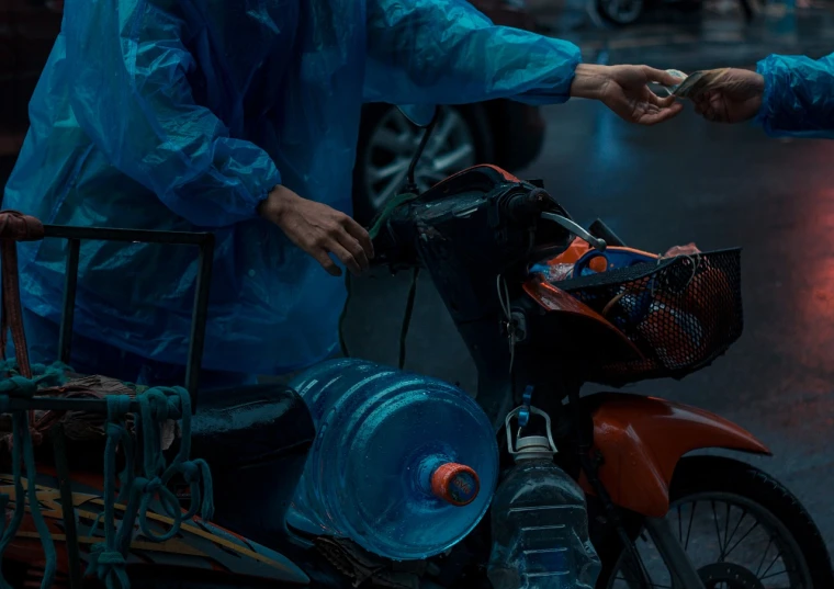 a person handing something to another person on a motorcycle, by Adam Marczyński, pexels contest winner, hyperrealism, urine collection bag, blue neon details, ismail inceoglu and ruan jia, water pipe