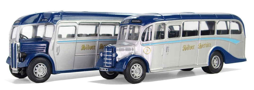 a close up of a toy bus on a white surface, by Paul Davis, pixabay, photorealism, silver and blue color schemes, set in ww2 germany, front and side view, 1934