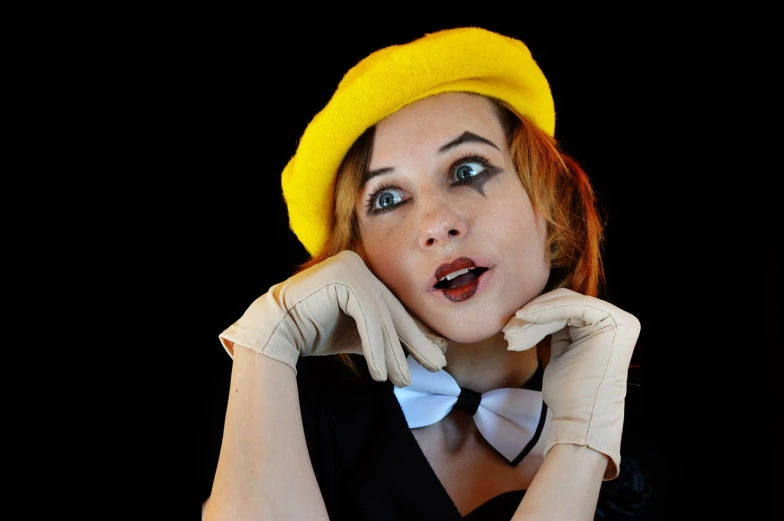 a woman wearing gloves and a yellow hat, a portrait, inspired by Grete Stern, flickr, mime, surprised, ' ramona flowers ', naughty