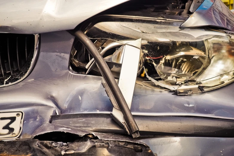 a close up of a headlight on a car, auto-destructive art, cars crashed, wide shot photo, made out of shiny white metal, fully body photo