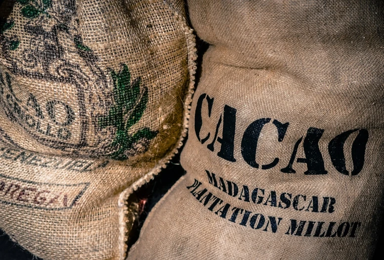 two bags of coffee sitting next to each other, by Matt Cavotta, sumatraism, megascans texture, bagdasarian productions, cascade, detail shot