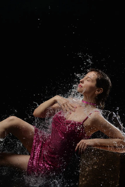 a woman in a pink dress splashing water on her body, a portrait, by Jan Rustem, flickr, portrait of combat dancer, 4k -4, iso 4 0 0, thirst