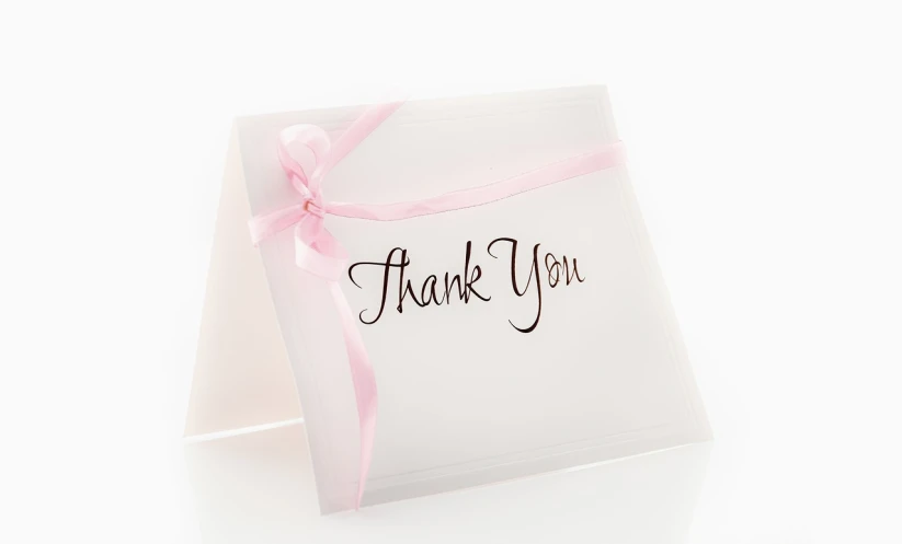 a thank card with a pink ribbon tied to it, flickr, smooth translucent white skin, commercial product photography, sandra chevier, white
