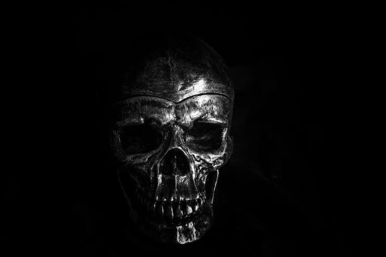 a black and white photo of a skull in the dark, by Adam Szentpétery, pexels contest winner, fine art, made out of shiny silver, hq 4k phone wallpaper, red skull, shot with iphone 1 0