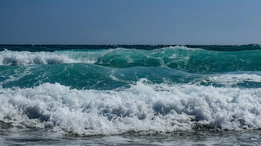 a man riding a wave on top of a surfboard, pexels, fine art, mediterranean beach background, azure waves of water, glistening seafoam, stock photo