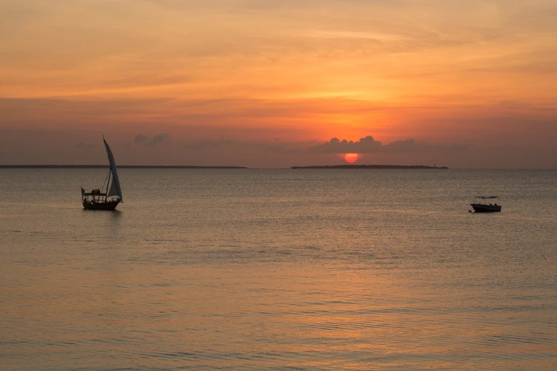 a couple of boats floating on top of a body of water, a photo, by Alexander Fedosav, fine art, sunset panorama, somalia, cuba, full image