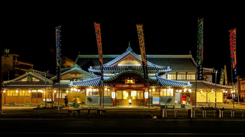 a building that is lit up at night, inspired by Baiōken Eishun, flickr, sōsaku hanga, albuquerque, station, in feudal japan, okinawa japan