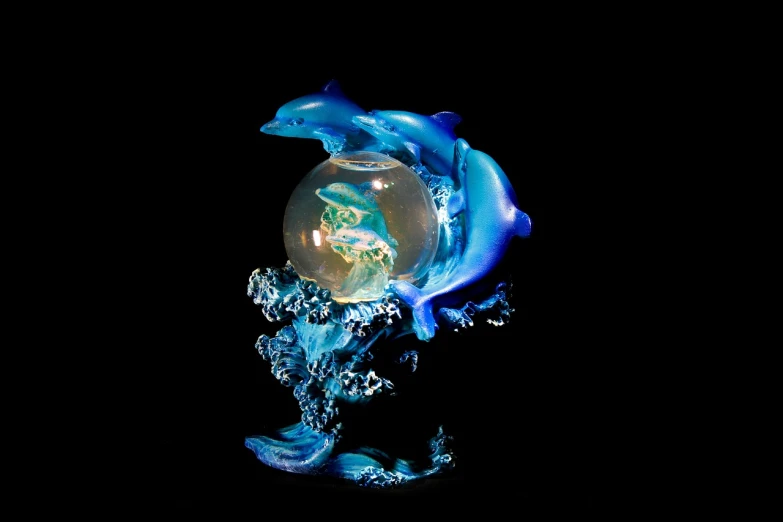 a close up of a glass sculpture of a dolphin, fine art, magical glowing sphere in midair, highly detailed product photo, twins, miniature product photo