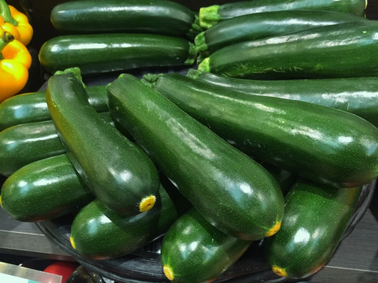 a pile of green zucchini sitting on top of a table, renaissance, high quality product image”, 🌻🎹🎼, pitt, f/4.5