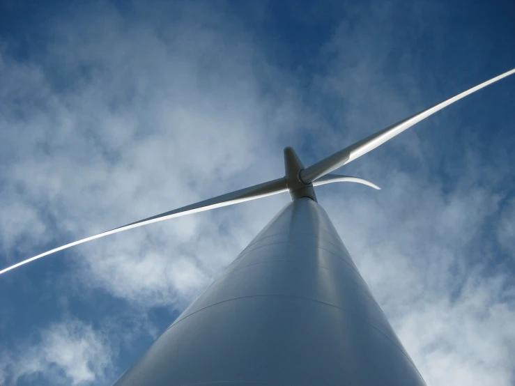 a close up of a wind turbine on a cloudy day, flickr, worm's-eye view, biggish nose, 2 0 1 0 photo, wip