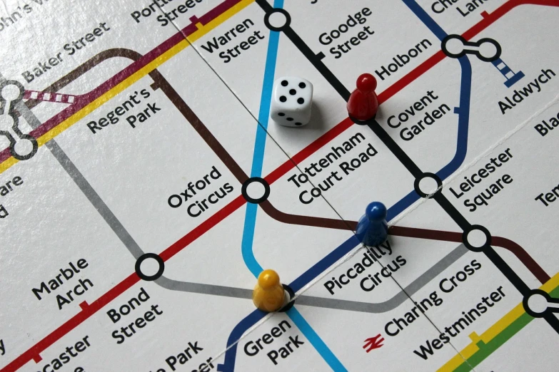 a close up of a map with a dice on it, by Rupert Shephard, flickr, graffiti, london underground tube station, playing board games, dezeen, detailed screenshot