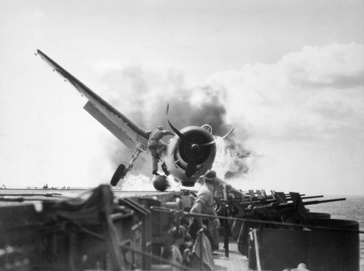 a black and white photo of a plane on a ship, by Bob Ringwood, burning, at takeoff, various posed, cherry