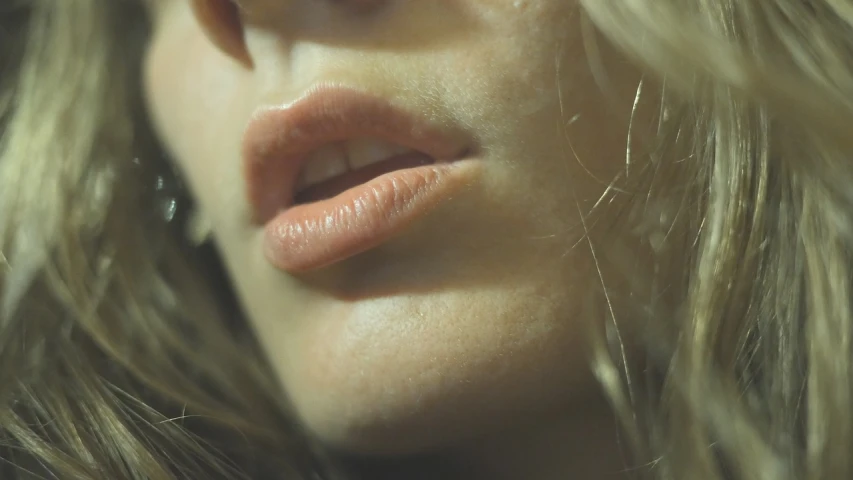 a close up of a woman's face with long hair, inspired by Nan Goldin, lips, 4 k hd film still, sebastian kruger, full body close-up shot
