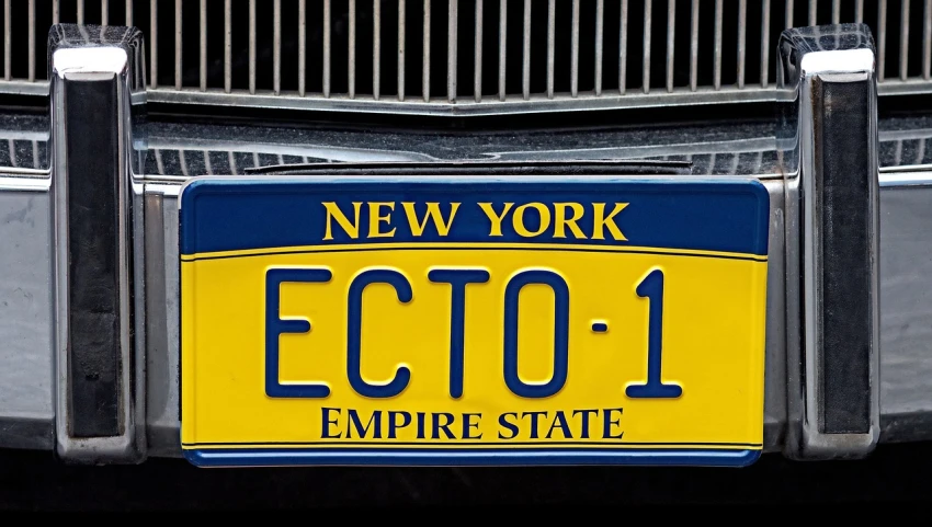 a close up of a license plate on a car, a photo, inspired by E. T. A. Hoffmann, flickr, art deco, empire state building, eos - 1 d, chie yoshii, blue and yellow spiderman