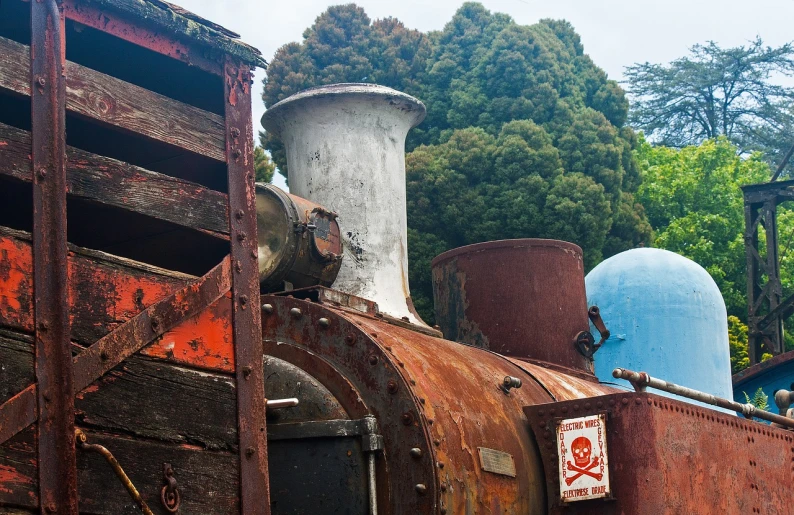 a close up of a train on a train track, a portrait, inspired by Tsuchida Bakusen, flickr, a still life of a rusty robot, victorian fire ship, tourist photo, sao paulo