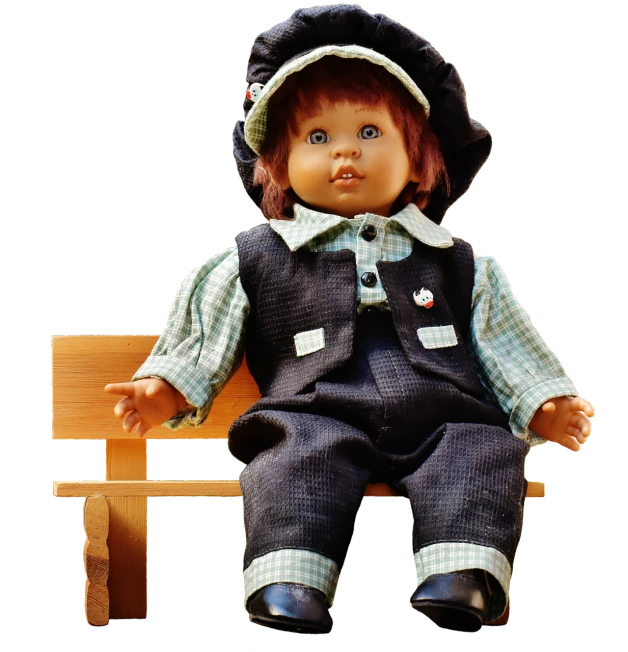 a doll sitting on top of a wooden bench, by Kurt Seligmann, trending on pixabay, realism, overalls, 1 9 7 0 s, with detailed facial features, black