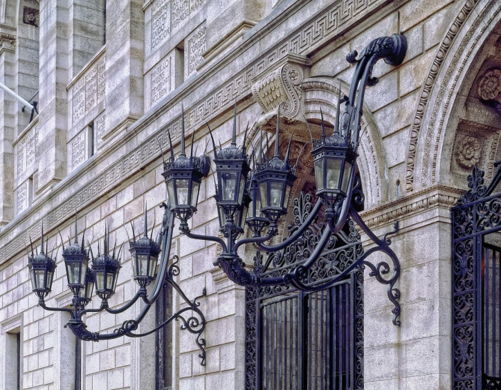 a clock mounted to the side of a building, by Luis Paret y Alcazar, art nouveau, chandeliers, parliament, wrought iron, taken in 1 9 9 7