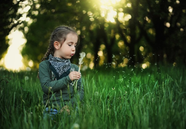 a little girl that is sitting in the grass, by irakli nadar, pixabay contest winner, digital art, smelling good, sunlight glistening, wind kissed picture, harmony of nature