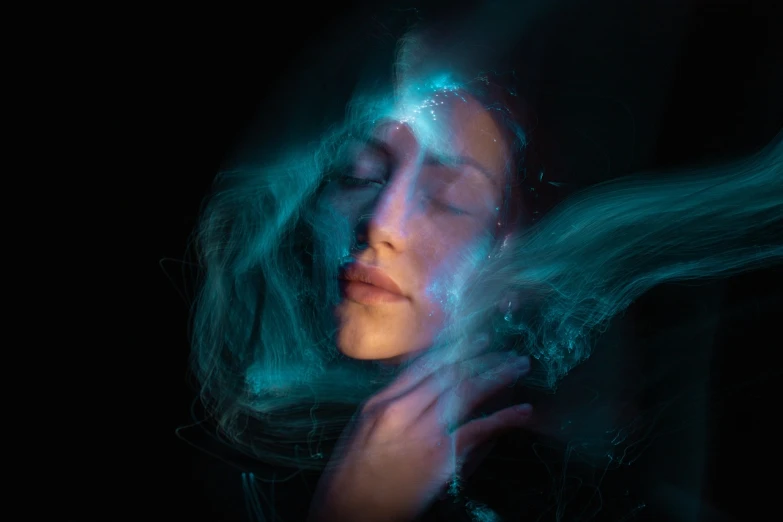 a close up of a person with long hair, by Jan Rustem, digital art, ethereal blue lighting, she is floating in the air, packshot, light falling on face