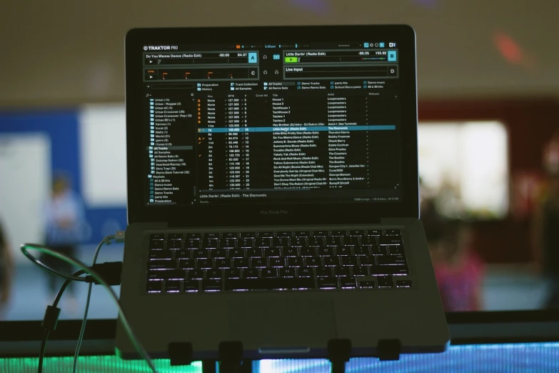 a laptop computer sitting on top of a table, by Romain brook, happening, dance trance edm festival, taken with canon 8 0 d, server in the middle, black interface