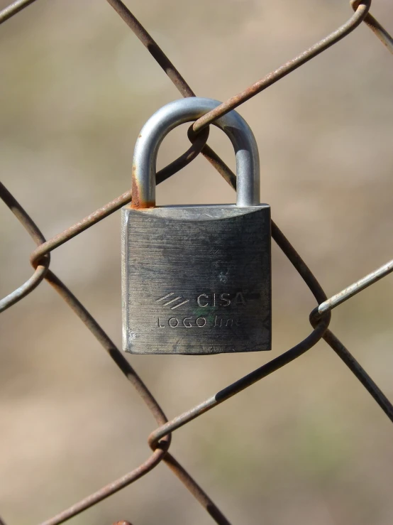 a padlock attached to a chain link fence, a portrait, flickr, costa blanca, closeup photo, shack close up, cad