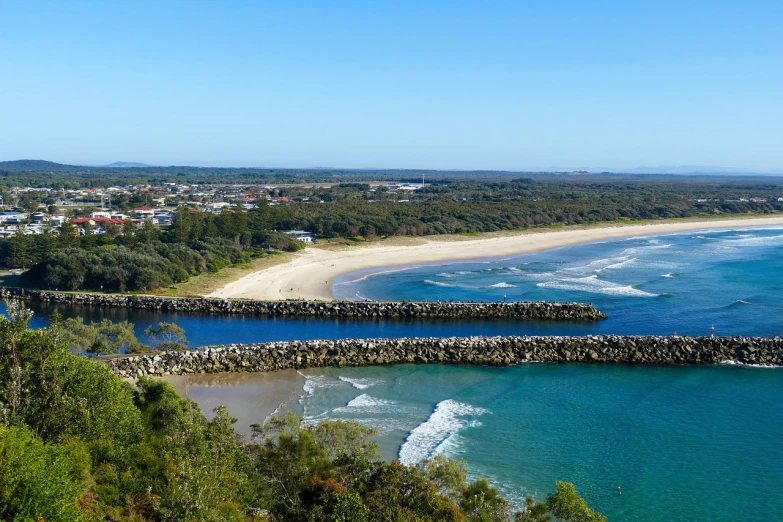 a view of a beach from the top of a hill, by Elizabeth Durack, shutterstock, harbour in background, panoramic shot, myrtle, 4k photo”