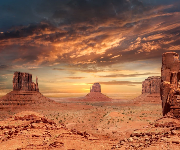 a large rock formation in the middle of a desert, shutterstock, dramatic sunset and dramatic sky, old west town, giant towering pillars, stock photo