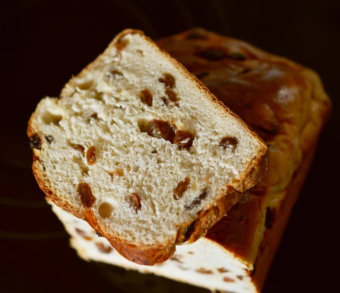 a close up of a loaf of bread on a plate, a portrait, by Jan Rustem, shutterstock, difraction from back light, cake, cross section, close-up product photo