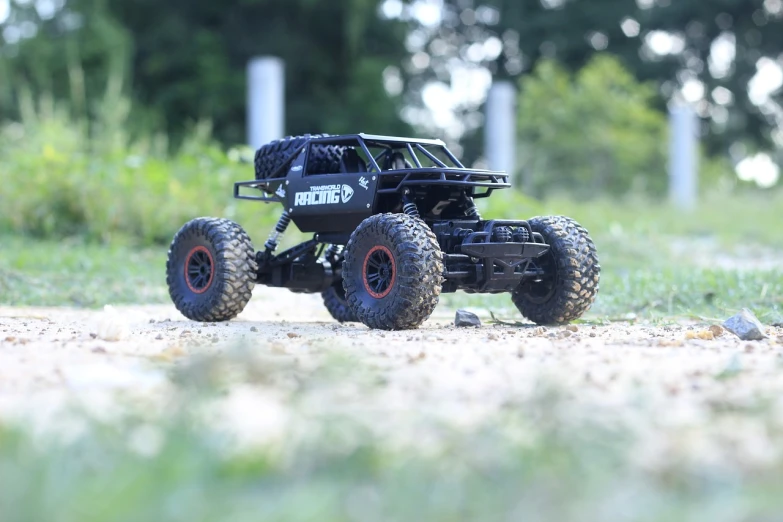 a toy truck sitting on top of a dirt road, all black matte product, buggy, high qulity, 4 0 mp