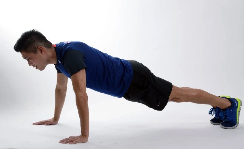 a man in a blue shirt doing a push up, figuration libre, basic, rectangular, tubes fused with the body, a tall