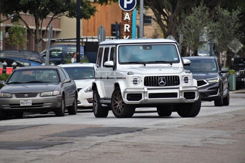 a white mercedes is driving down the street, pch, bella hadid, usa-sep 20, cardi b