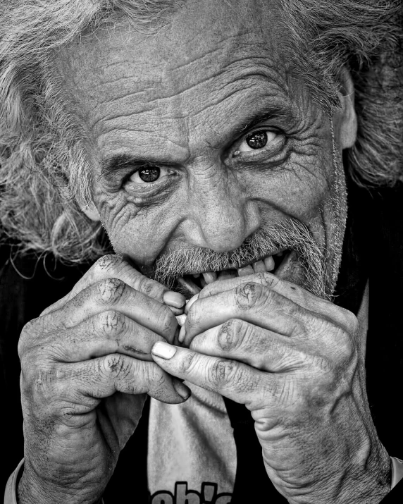 a black and white photo of an old man, a black and white photo, pexels contest winner, fine art, goofy smile, hand over mouth, homeless, color photograph portrait 4k