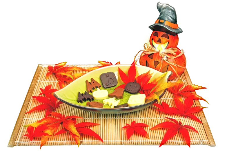 a close up of a plate of food on a table, a digital rendering, mingei, halloween theme, miniature product photo, leaf, vivid)